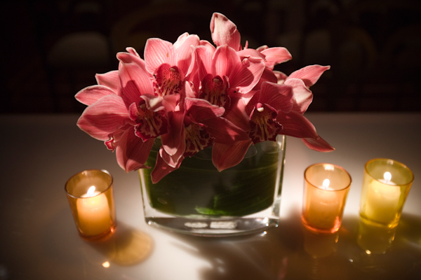 Pink orchid centerpiece with candles - wedding photo by J Garner Photography